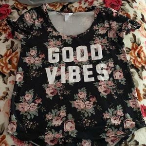 This is a graphic tee with a floral print